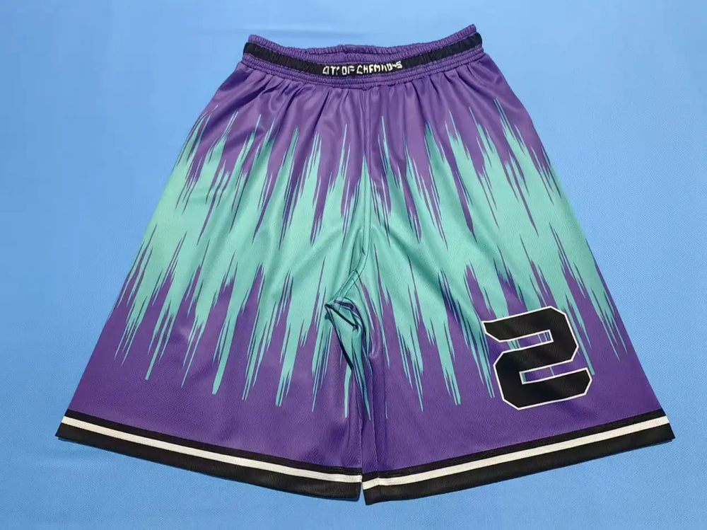 Custom sublimated basketball shorts with cyan and purple gradient graphic print