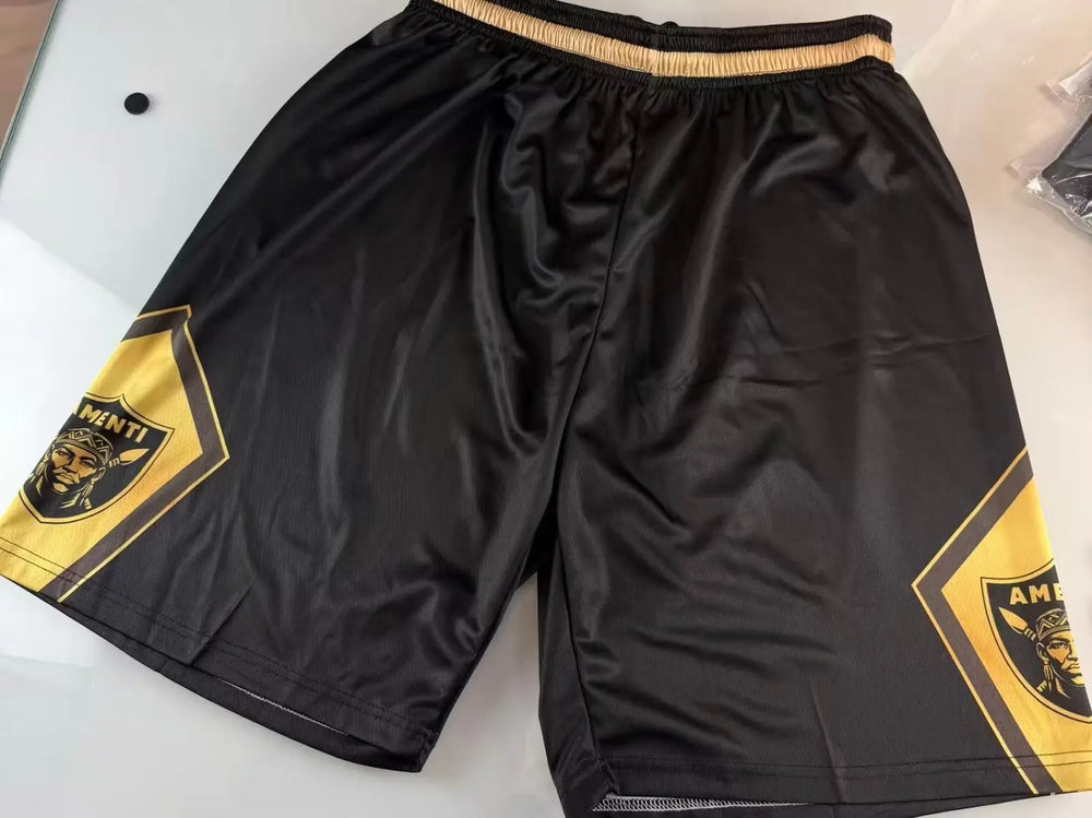 Custom black basketball shorts with bold gold contrast side panels and drawstring