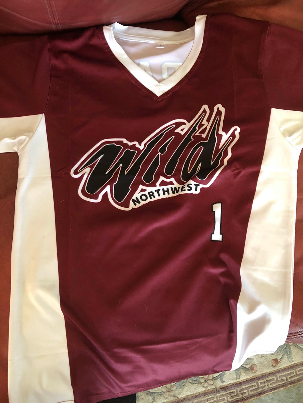 Custom short sleeve volleyball jersey with sublimated team crest and numbers
