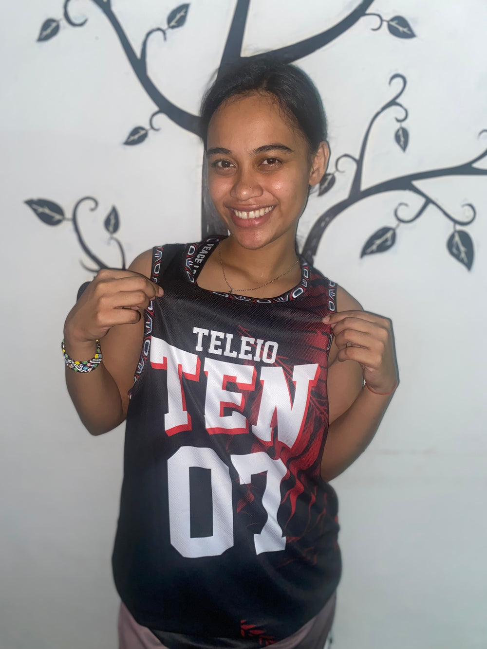 Custom sleeveless volleyball jersey on player during game