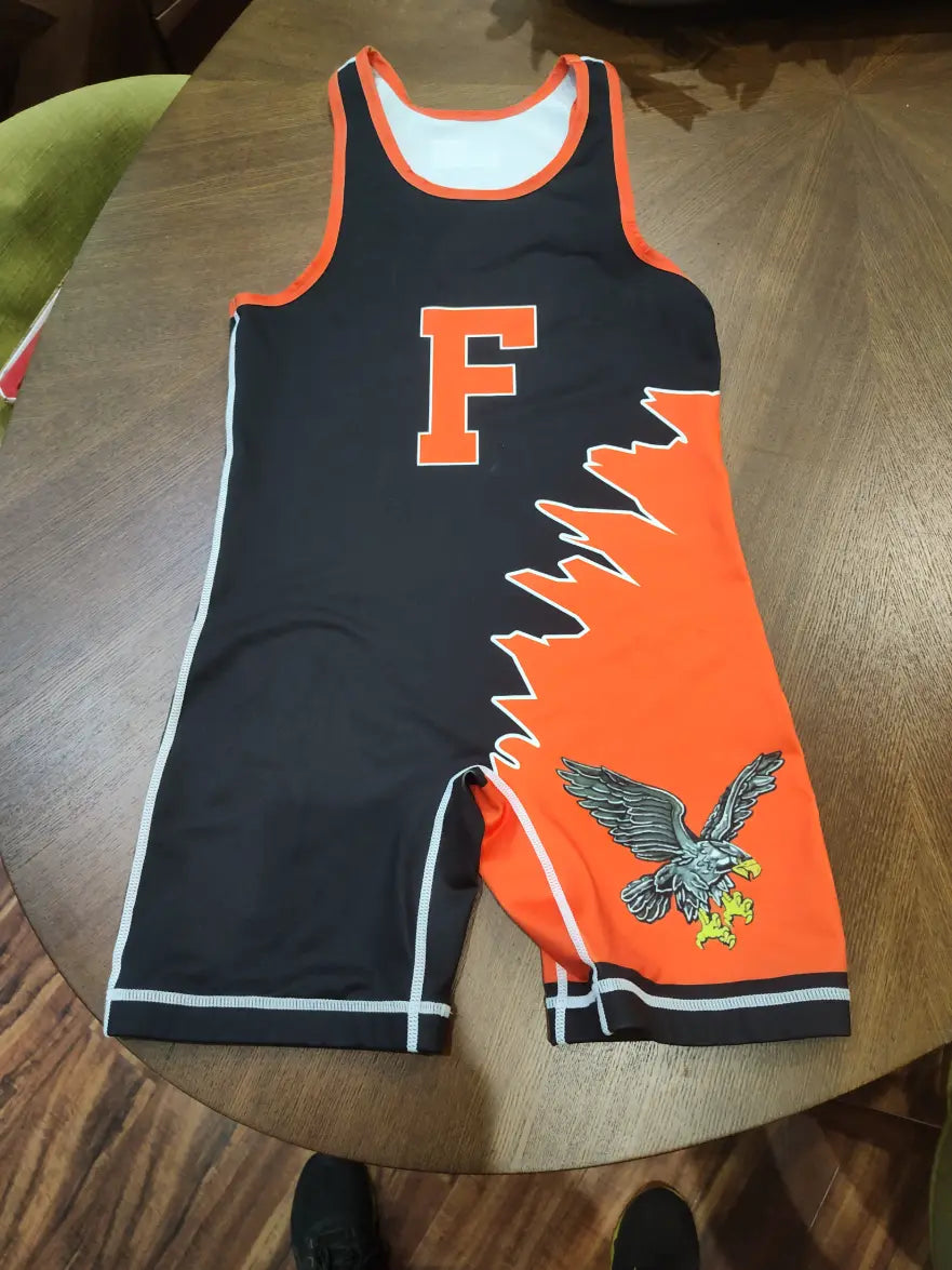 Firebird dual-tone asymmetric black and orange wrestling singlet