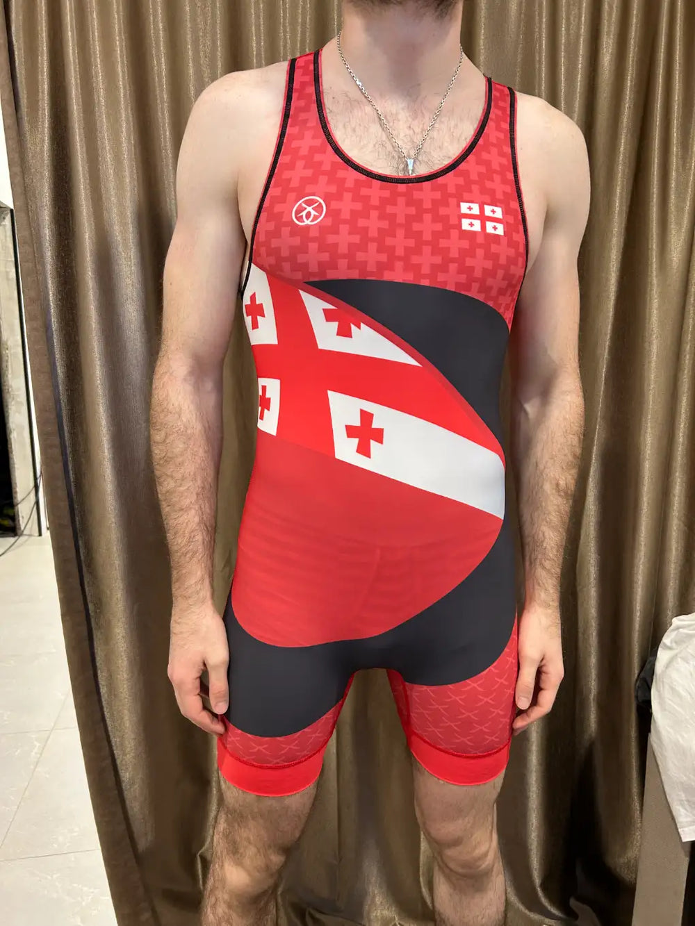 International dual-corner national team wrestling singlet on wrestler