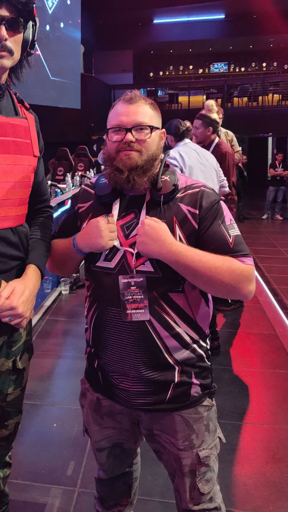 Competitive esports champion on tournament stage wearing custom jersey